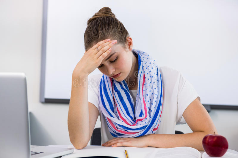 stressed-teacher-suffering-headache-classroom-front-view-77708362.jpg stressed-teacher-suffering-headache-classroom-front-view-77708362.jpg